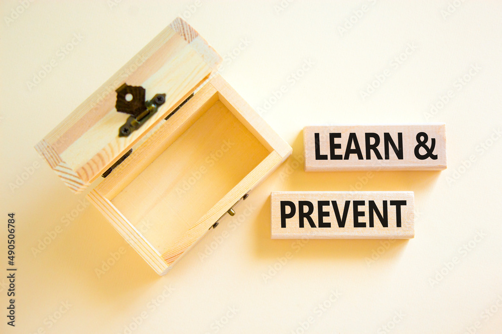 Learn and prevent symbol. Concept words Learn and prevent on wooden blocks on beautiful white table white background. Empthy wooden chest. Business learning and learn and prevent concept, copy space. Learn and prevent symbol. Concept words Learn and prevent on wooden blocks on beautiful white table white background. Empthy wooden chest. Business learning and learn and prevent concept, copy space.