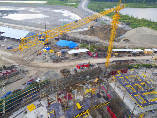 construction of a hotel with the help of tower cranes, in the mountains against the backdrop of beautiful nature