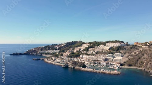 Wallpaper Mural Aerial perspective of La Herradura city - Malaga Spain. Beautiful coastal city situated in south of Spain. View of the port and luxury urbanisation on hills. Mountains in background. Dolly forward Torontodigital.ca