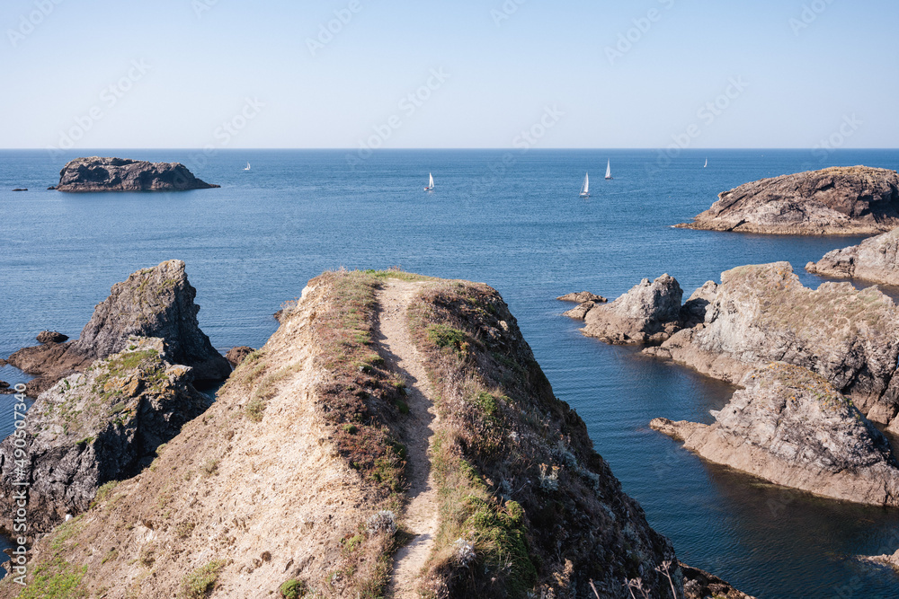 A trail leads to a viewpoint on a rock on the coast of the island of Belle-ile en Mer.