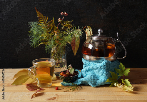 Teapot with herbal autumn tea