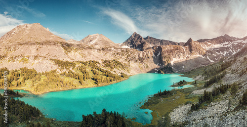 Atmospheric and moody aerial drone point of view of turquoise Krepkoe Lake at sunset. National park and natural wonders background