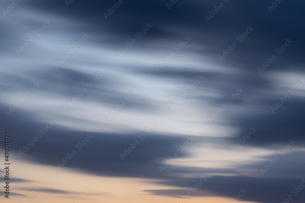 Fototapeta premium Sky with abstract clouds at dusk - background in long exposure