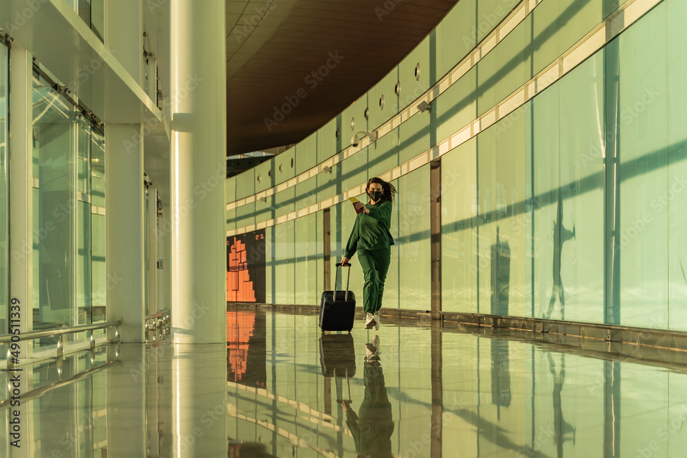 woman running through the airport