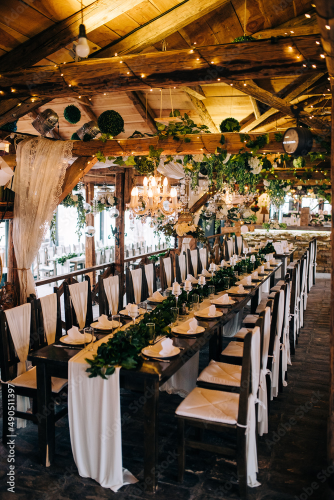 Fototapeta premium Table setting at a luxury wedding and beautiful flowers on the table.