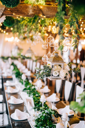 Table setting at a luxury wedding and beautiful flowers on the table.
