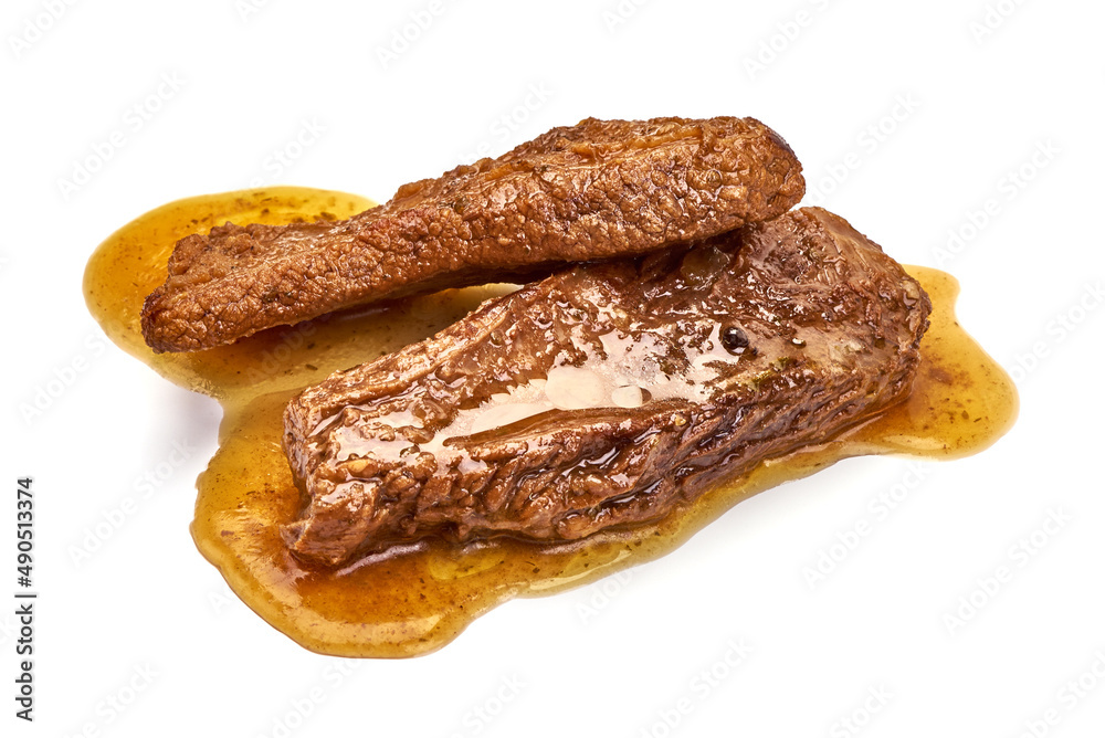 Delicious spare ribs with sauce, isolated on white background. Delicious spare ribs with sauce, isolated on white background.