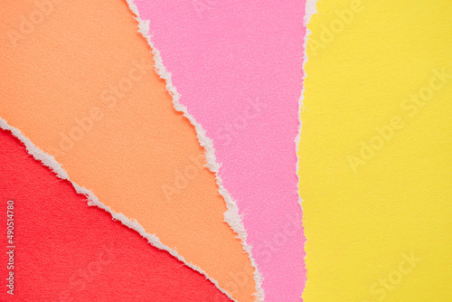 The ripped colored paper background.