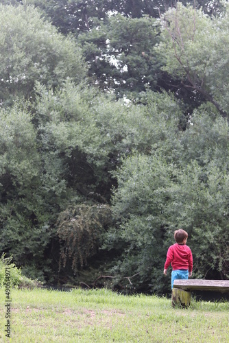 Boy overlooking a river