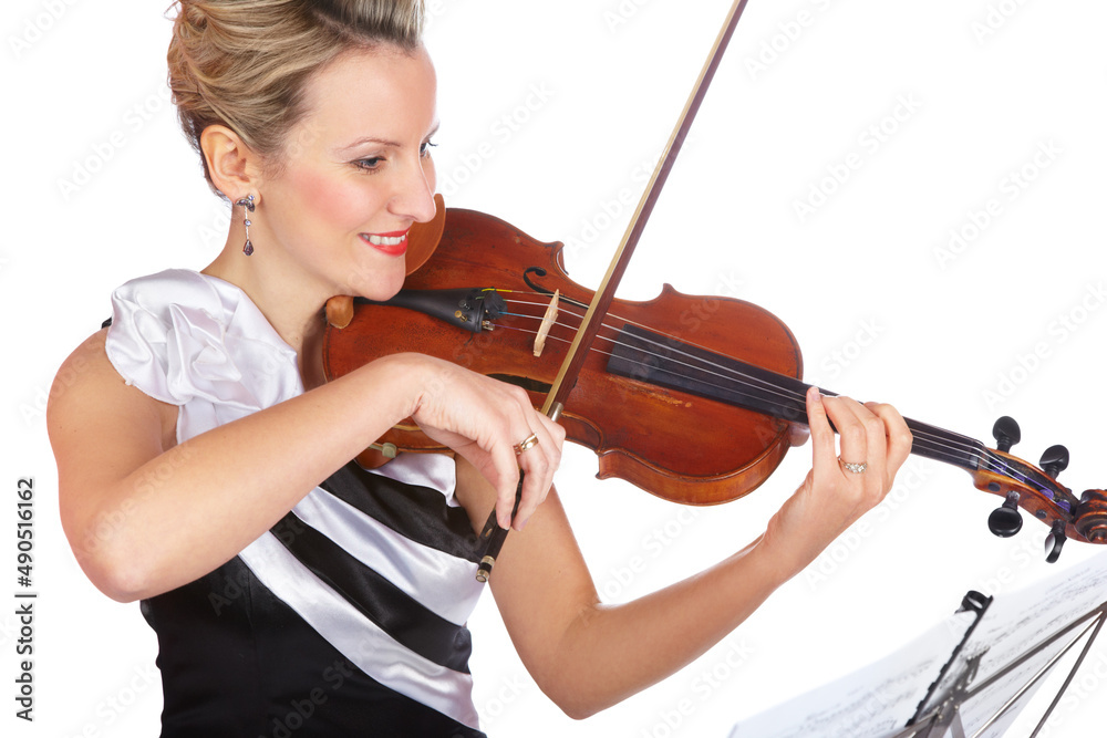 This sonata plucks at my heart strings. A lovely young woman wearing an evening dress playing violin. This sonata plucks at my heart strings. A lovely young woman wearing an evening dress playing violin.