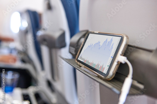 Airplane cabin interior with smartphone charging batteries. Travel