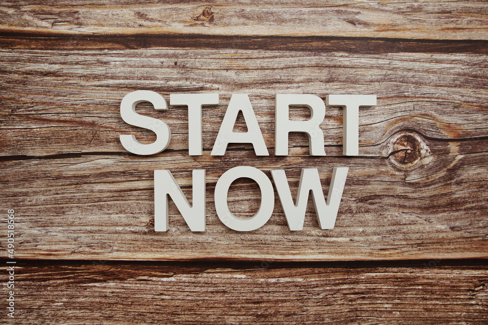 Start Now Word alphabet letters on wooden background