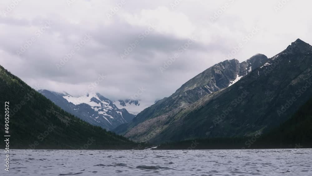 Timelapse video of a mountain lake on a cloudy day. Atmospheric landscape of fishing and hiking Timelapse video of a mountain lake on a cloudy day. Atmospheric landscape of fishing and hiking