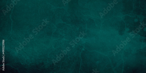 Grunge background with space chalkboard or blackboard green texture. Empty blank with copy space for chalk text. Used feel with chalk traces and great texture. Chalkboard texture. Dark blackboard.
