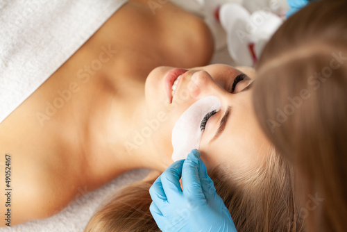 Eyelash Extension Procedure  Professional stylist lengthening female lashes