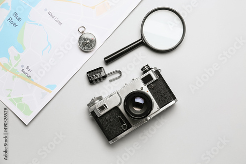 Set of travel items with photo camera on white background
