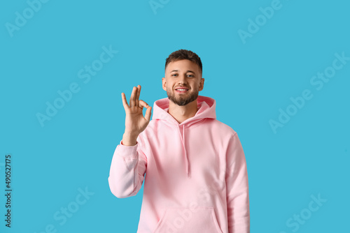 Young guy in stylish hoodie...