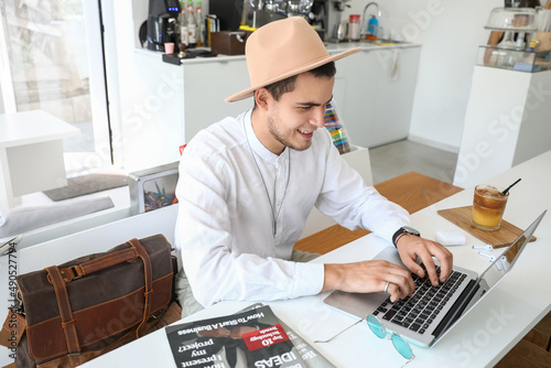 Handsome young man working ...
