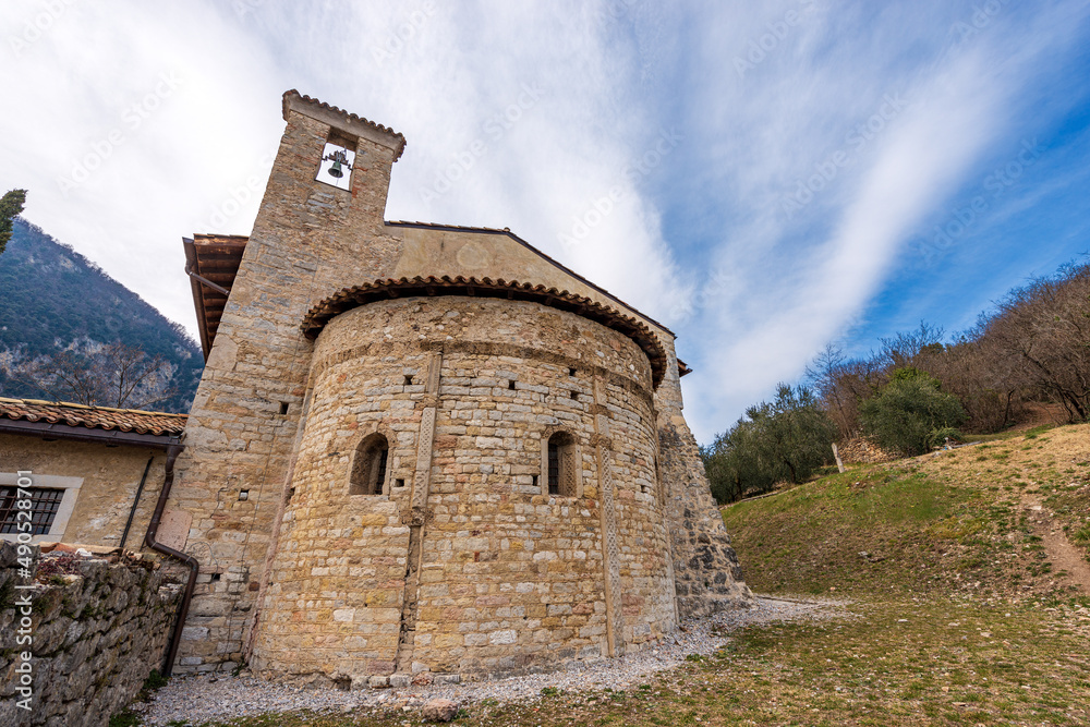 Small ancient church of San Lorenzo Martire (St. Lawrence Martyr) in Romanesque Gothic style, XII century. Tenno village, Trento province, Trentino Alto Adige, Italy, Europe.