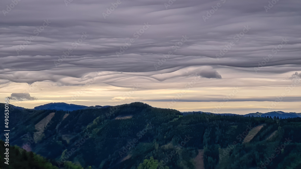Mystical clouds and scenic view from mount Roethelstein near Mixnitz in Styria, Austria. Landscape of green alpine meadow and bushes in the valley of Grazer Bergland in Styria, Austria. Cloudscape Mystical clouds and scenic view from mount Roethelstein near Mixnitz in Styria, Austria. Landscape of green alpine meadow and bushes in the valley of Grazer Bergland in Styria, Austria. Cloudscape