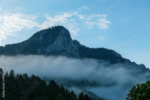 Scenic view on mount Roethelstein near Mixnitz in Styria, Austria. Morning landscape of low-lying clouds drifting and climbing through mountain valleys in Grazer Bergland in Styria, Austria. Sunrise photo