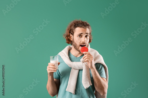 Handsome man with glass of ...