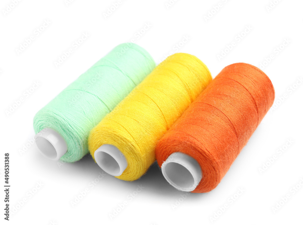 Beautiful sewing threads on white background Beautiful sewing threads on white background