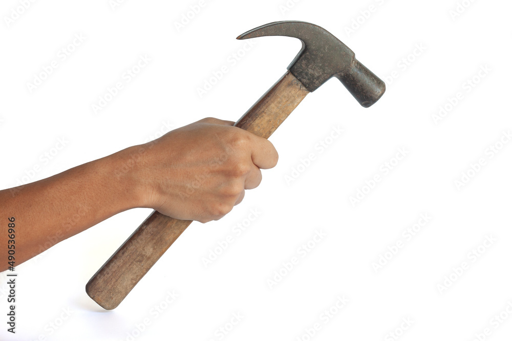Hand of carpenter holding a old hammer isolated on white background. Hand of carpenter holding a old hammer isolated on white background.