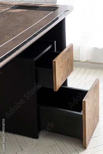 Opened drawer cabinet furniture wooden table at workplace