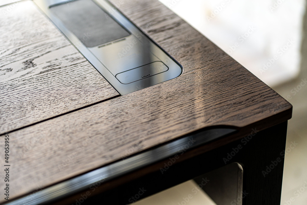 Mobile phone with wireless charger on table. Modern workplace accessory Mobile phone with wireless charger on table. Modern workplace accessory
