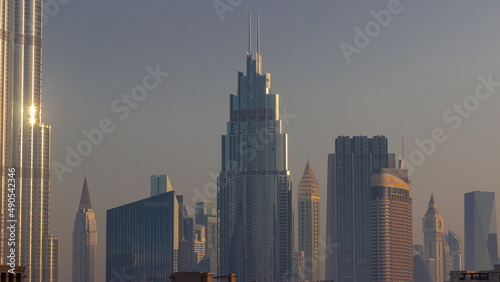 Row of the tall buildings around Sheikh Zayed Road and DIFC district aerial timelapse in Dubai