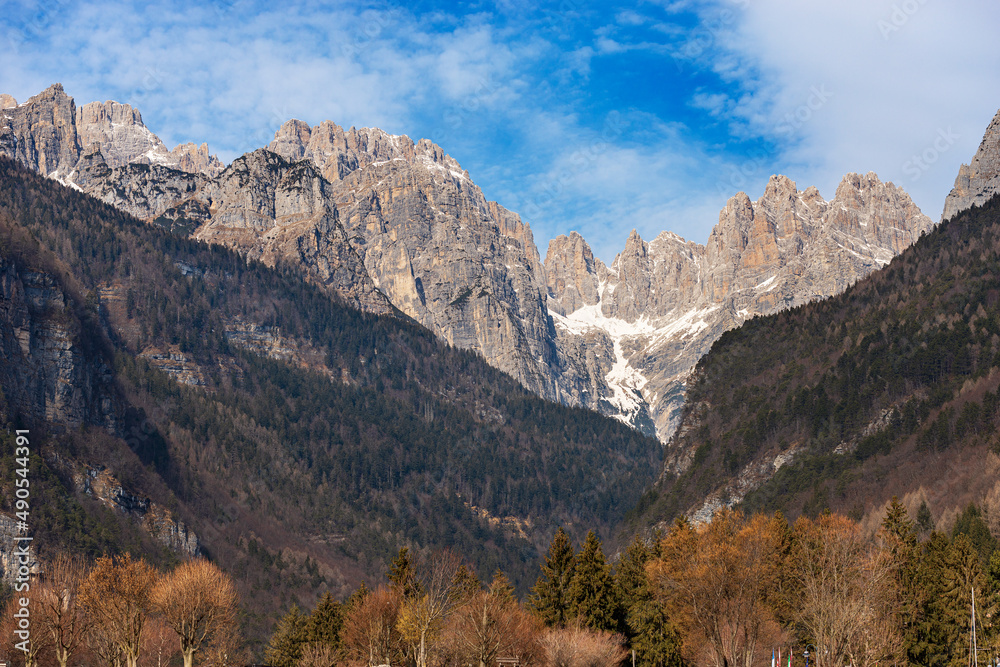 Mountain range and peaks of Brenta Dolomites, National Park of Adamello Brenta view from Molveno lake in winter. UNESCO world heritage site, Trentino Alto Adige, Trento province, Italy, Europe.