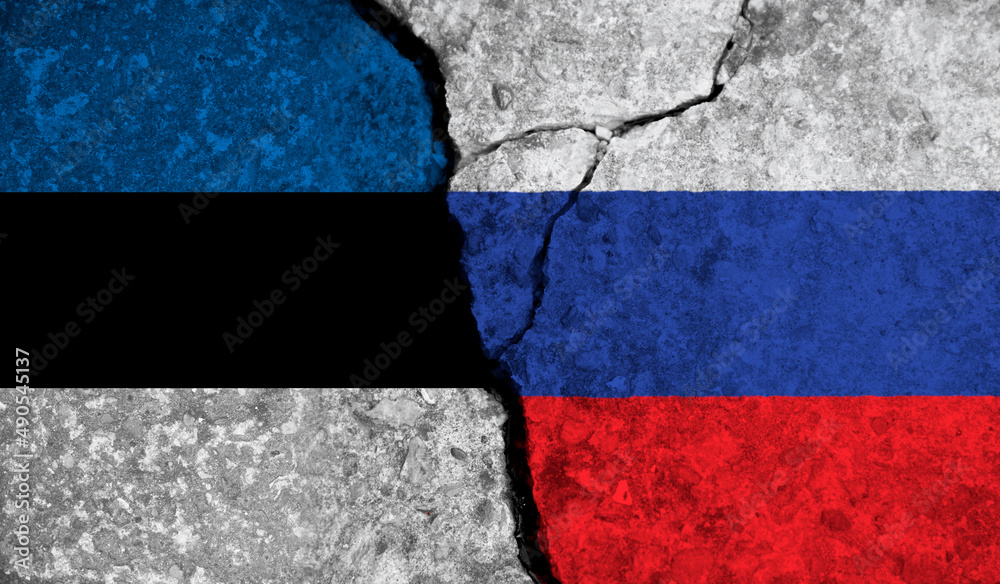 Political relationship between Estonia and russia. National flags on cracked concrete background