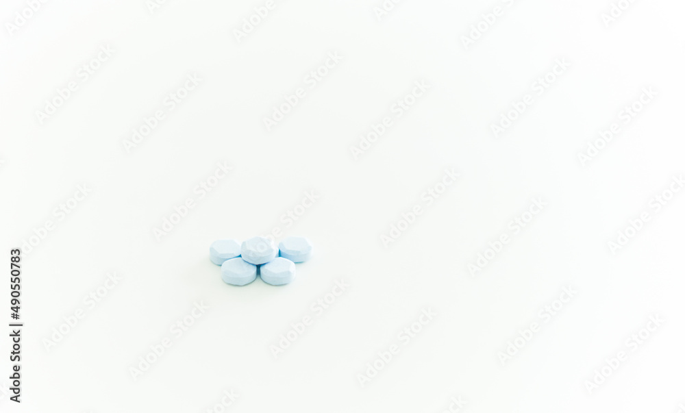 blue pill on table with bottle blue pill on table with bottle