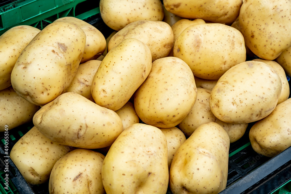 Fresh Uncooked Potatoes On A Market Stall Fresh Uncooked Potatoes On A Market Stall