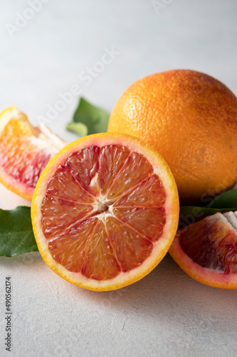 Bloody orange fruits composition. Abstract citrus fruit on bright background.