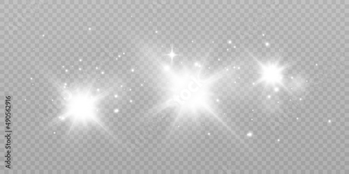 Sparks of dust and bright stars shine with a special light. Vector sparkles on a transparent background. Christmas light effect. Shiny magical dust particles.