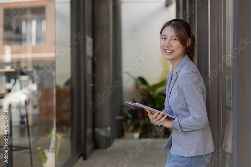 Free Download Beautiful Asian woman is a businesswoman who leads a new generation of startups, a woman who runs and manages a business plan to build confidence and stability in business, woman-led business concept. - GFXLoad