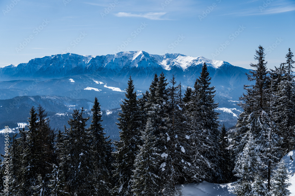 snow covered mountains, viewpoint from Postavaru Mountains to Bucegi, Romania 