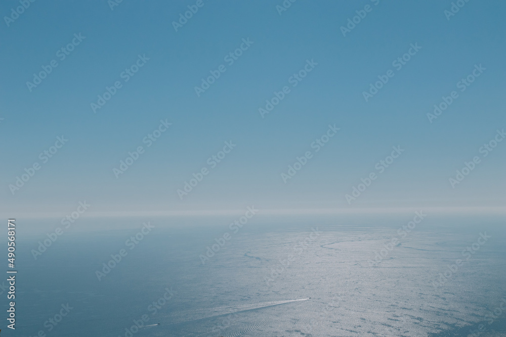Sea view landsacape from drone. Calm water surface. Blue sea and sky