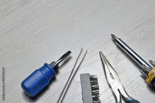 a working tool for minor repairs is laid out on the table