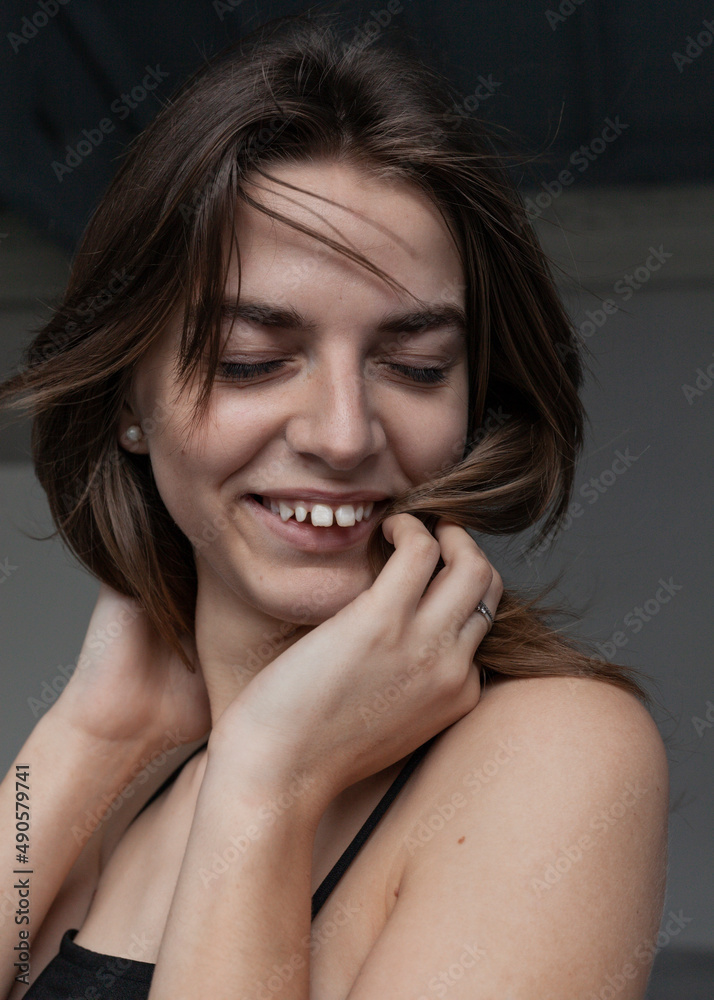 Fototapeta premium portrait of a laughing girl with beautiful hair