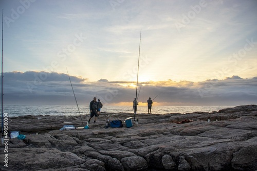 Men fishing with a view of the south coast of South Africa