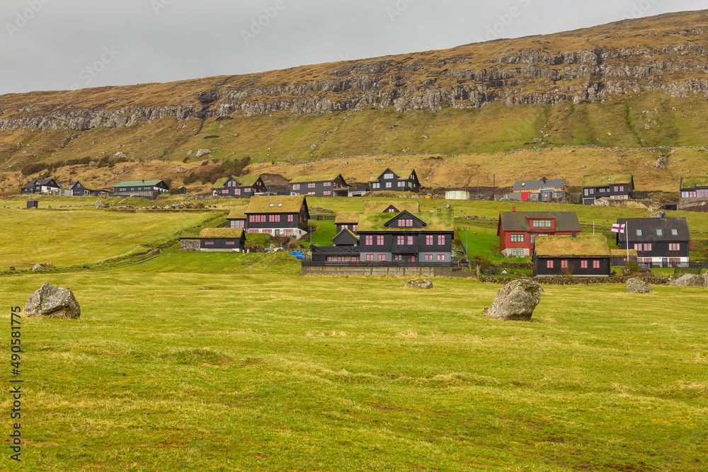 View of the small village situated on the slope of a hill, Kirkjubour, Faroe Islands.