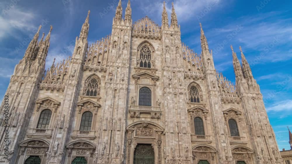 The Duomo cathedral timelapse hyperlapse at sunset. Front view with people sitting on stairs The Duomo cathedral timelapse hyperlapse at sunset. Front view with people sitting on stairs