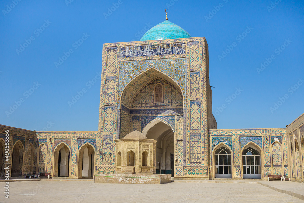 In the courtyard of the Kalan Mosque in Bukhara, Uzbekistan. Structure was built in 1515. It is part of the Poi-Kalyan architectural ensemble