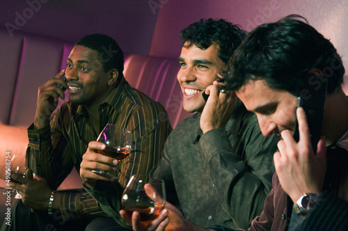 Multi-ethnic men talking on cell phones