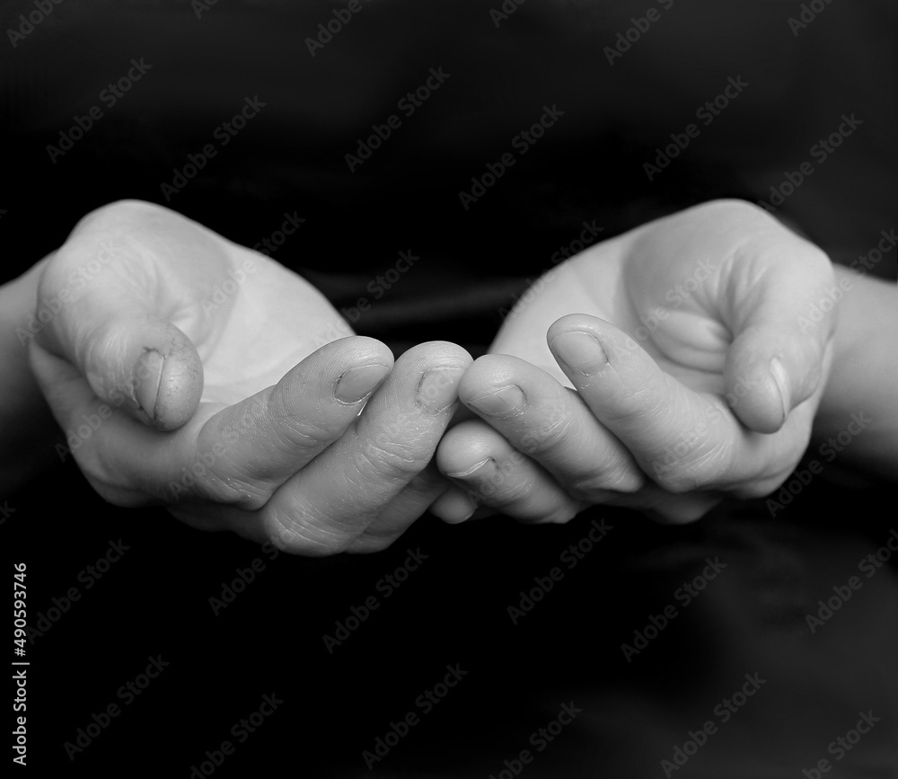 praying to god with hands together with dark background stock photo praying to god with hands together with dark background stock photo