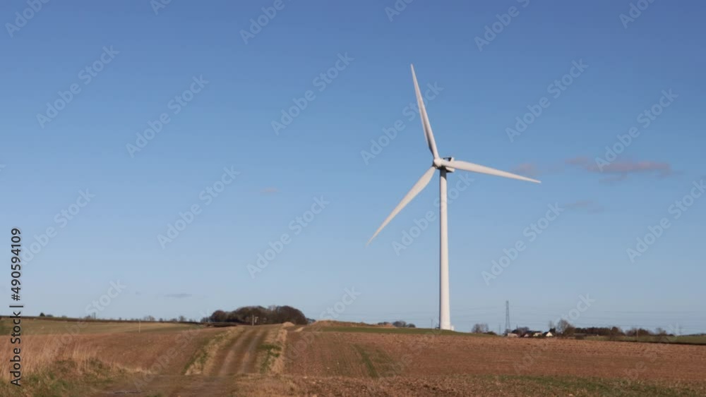 Wind turbine for green energy rotating in sunshine. Wind turbine for green energy rotating in sunshine.