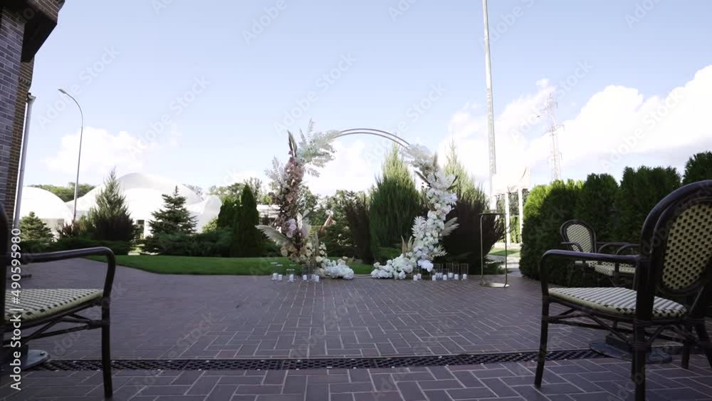 custom made wallpaper toronto digitalDecorations for an outdoor wedding ceremony. Round arch of flowers for young people and chairs for guests